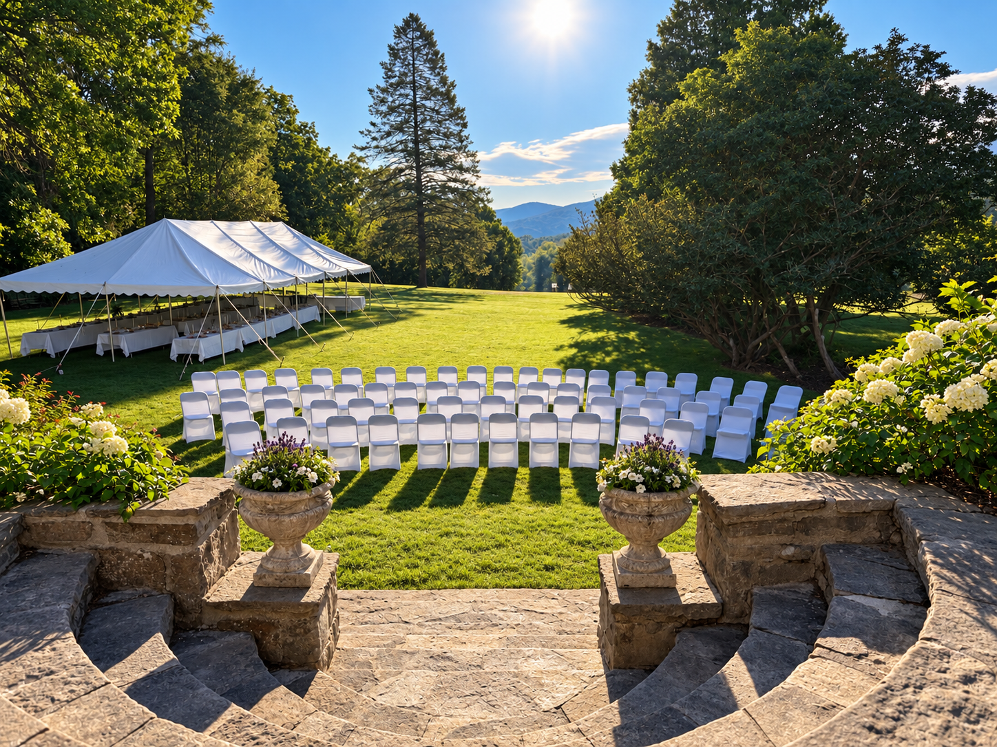 Stone staircase overlooking a pastoral meadow set for an intimate wedding at Storm King Lodge.